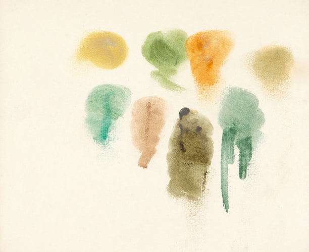 Here are a few options: * watercolor paint swatches are shown on white paper. * various hues of watercolor paint are swirled.