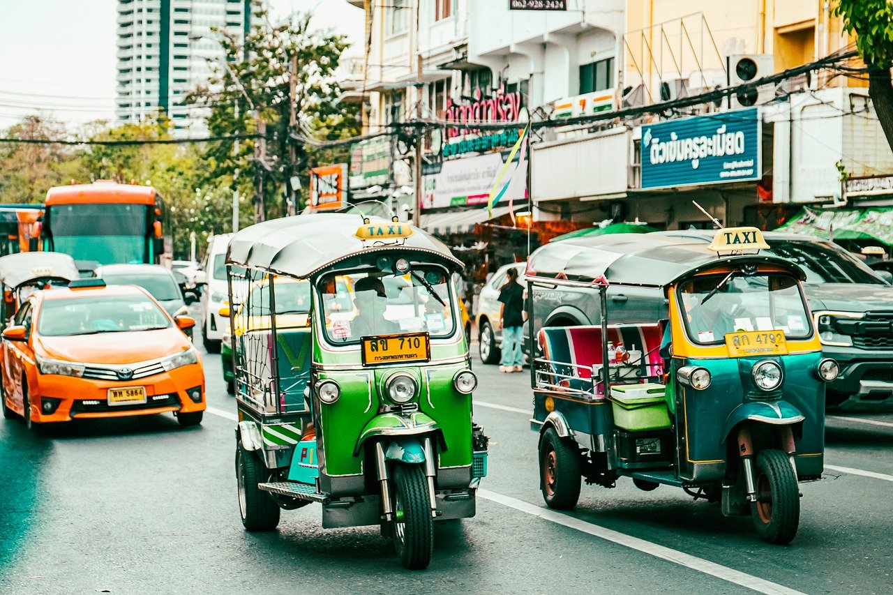 bangkok, thailand, cityscapes, vehicles, bikes, travel, bustling, crowds, crowded, tourism, sightseeing, transportation, markets, festivity, outdoor, ambiance, landscape, adventure, lively, daylight, navigate, motion, exploration