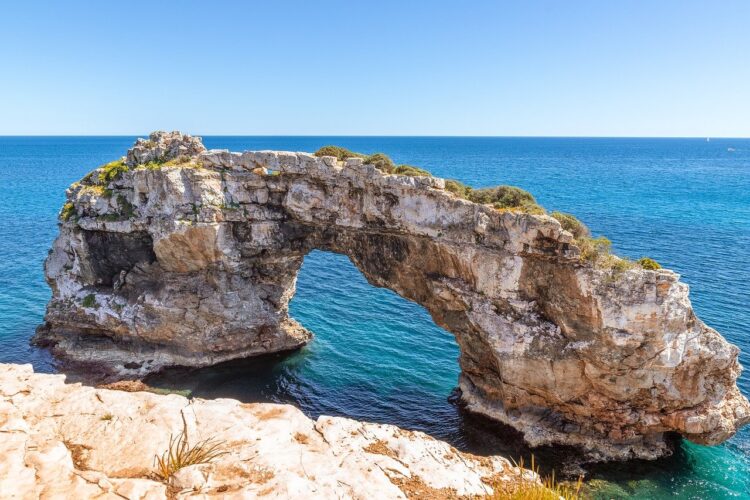 mallorca, arch rock, nature, coastline, mediterranean sea, spain, rocks, holiday, tourism, view, sunlight, idyllic, natural wonder, rock gate, santanyí, blue sky, outdoor, windy, coastal drama, calm sea