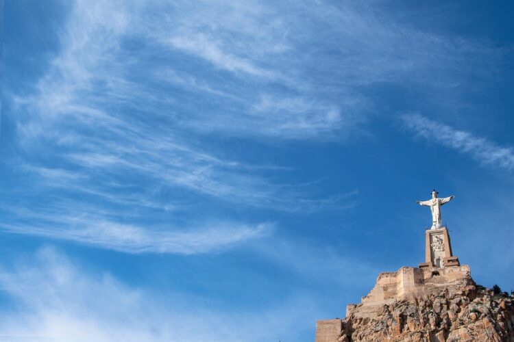 landscape, statue, clouds, sky, mountain, christianity, religion, jesus statue, arches, stone, monument, building, tower, cross, view, wings, tourism, natural, symbol